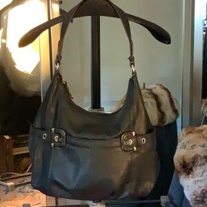 Pristine Tignanello black leather bag with silver details.